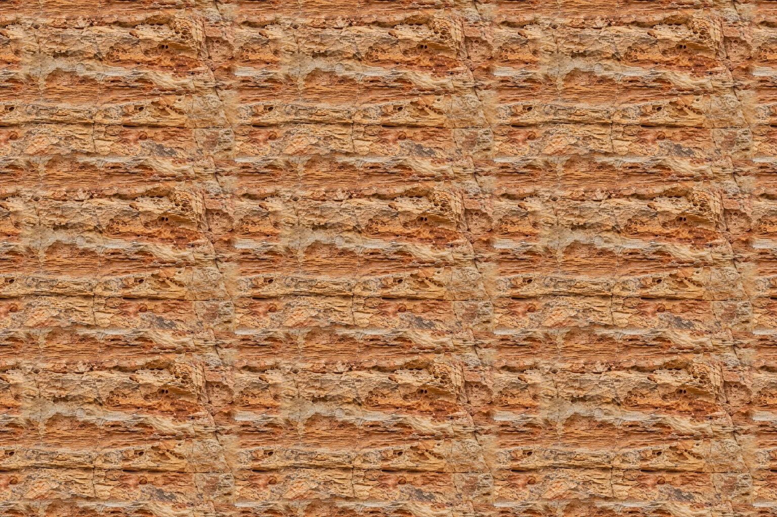 A sandstone photo made tileable with the seamless texture generator, repeated three by three with no visible seams
